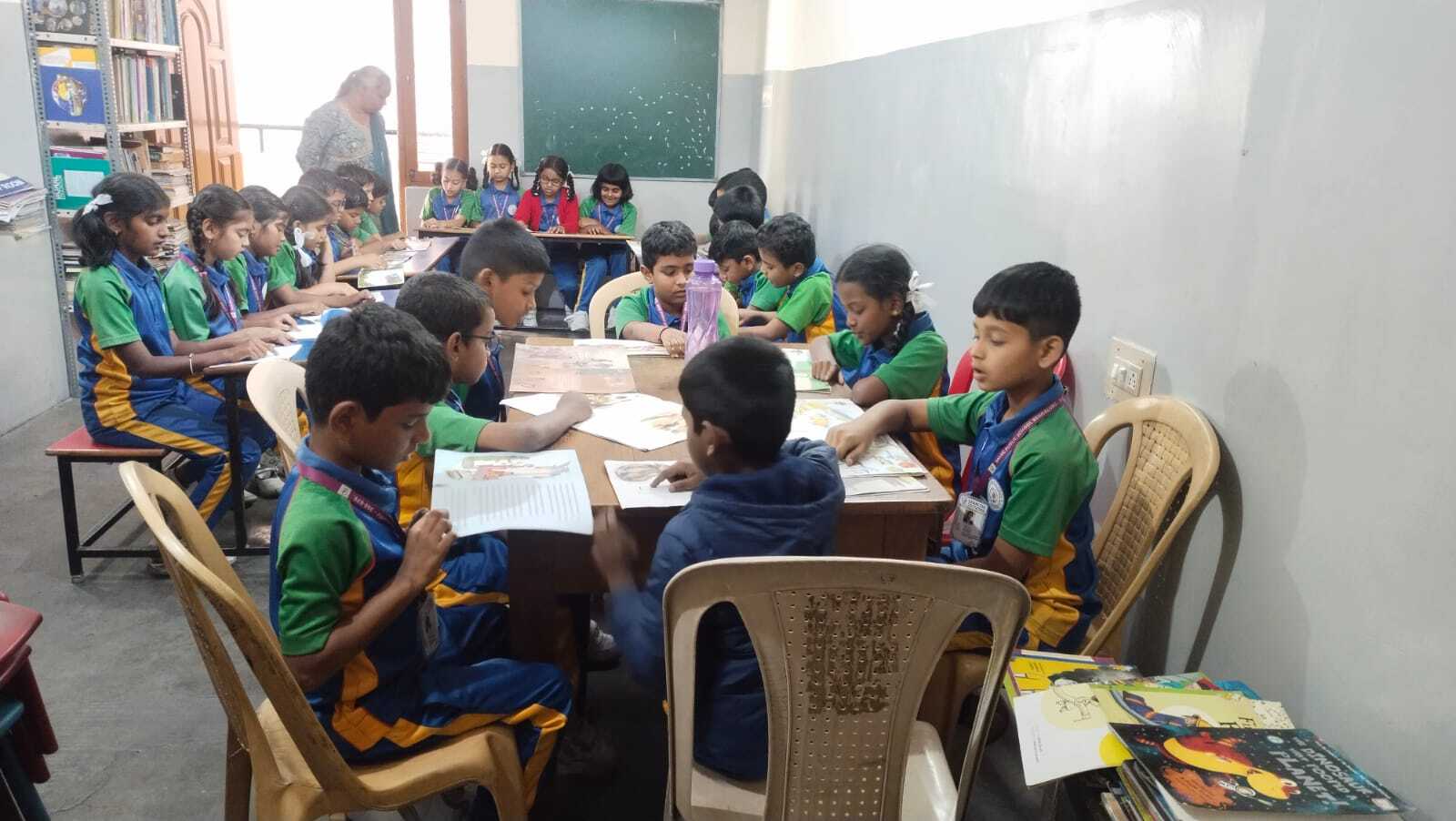 Students reading together at a classroom table