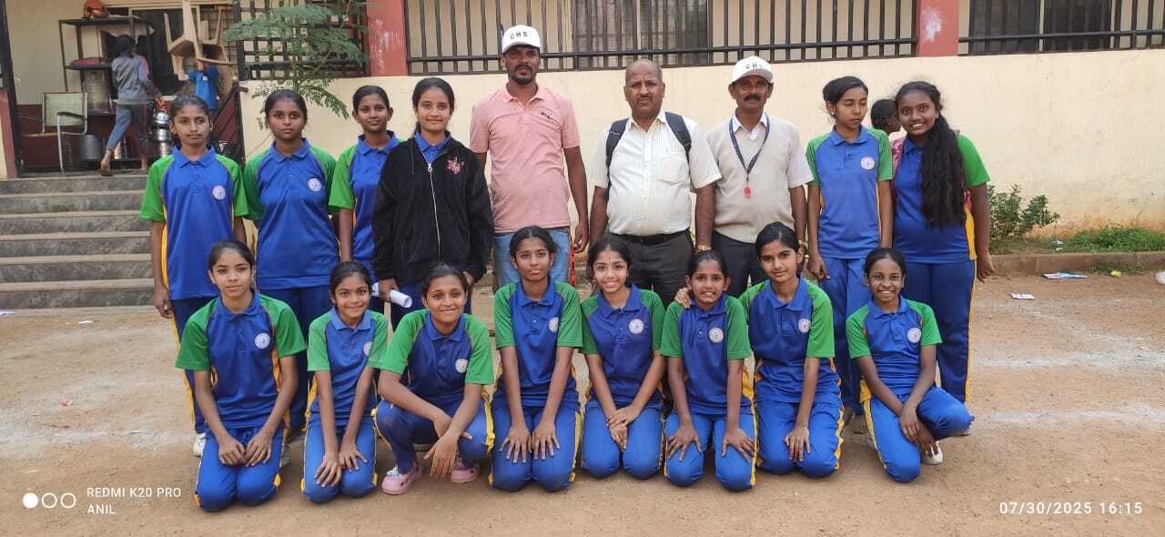 SPARC girls sports team with coaching staff at a tournament